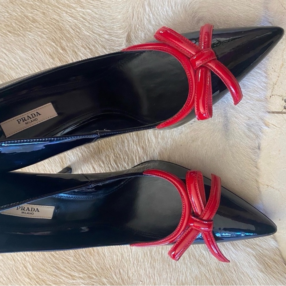 Gorgeous Prada Women's Glossy Black Heels with Red Bow.